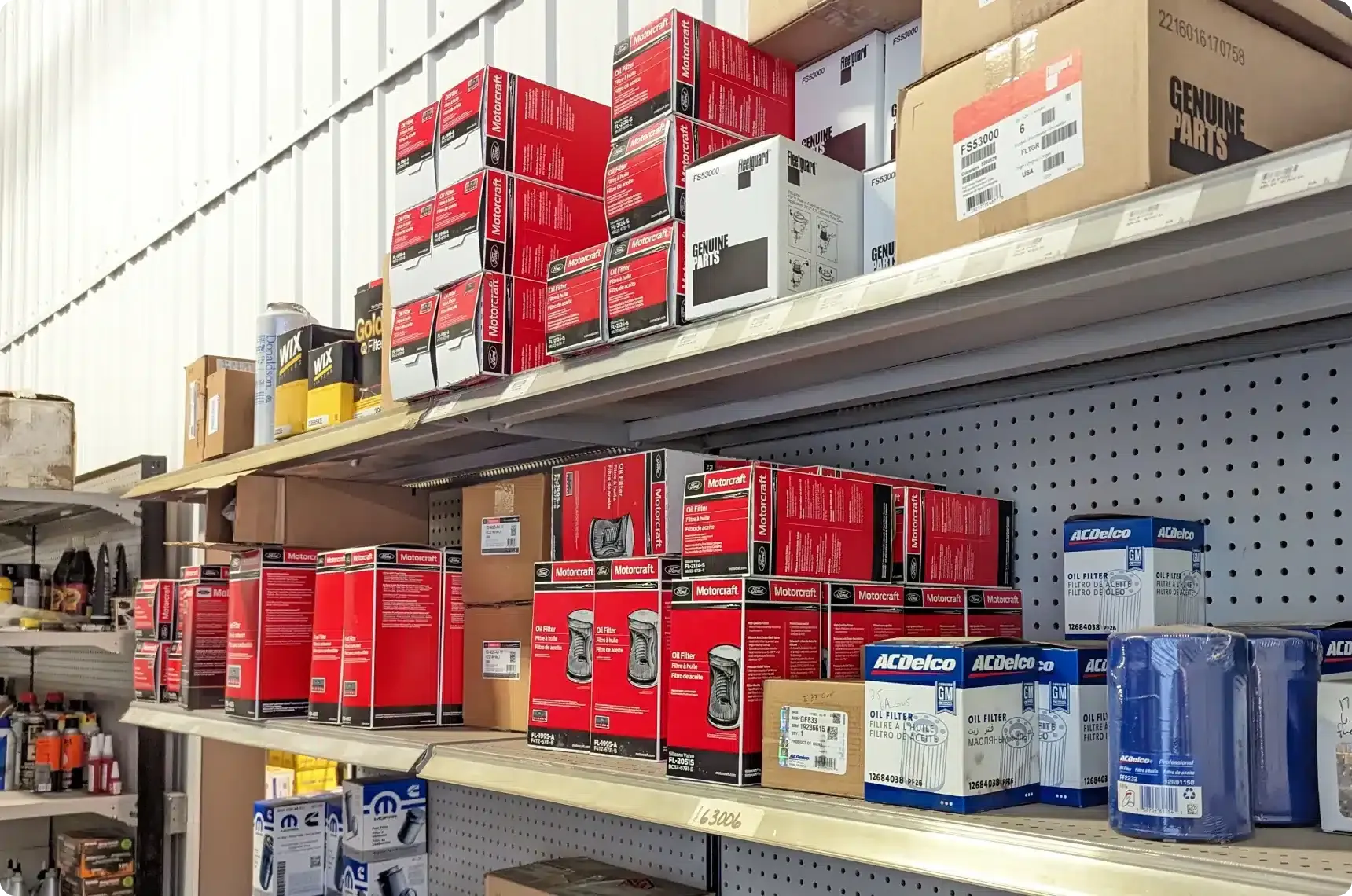 Shelves stocked with Monroe, ACDelco and genuine parts boxes in the 1023 Diesel & Fleet parts room.