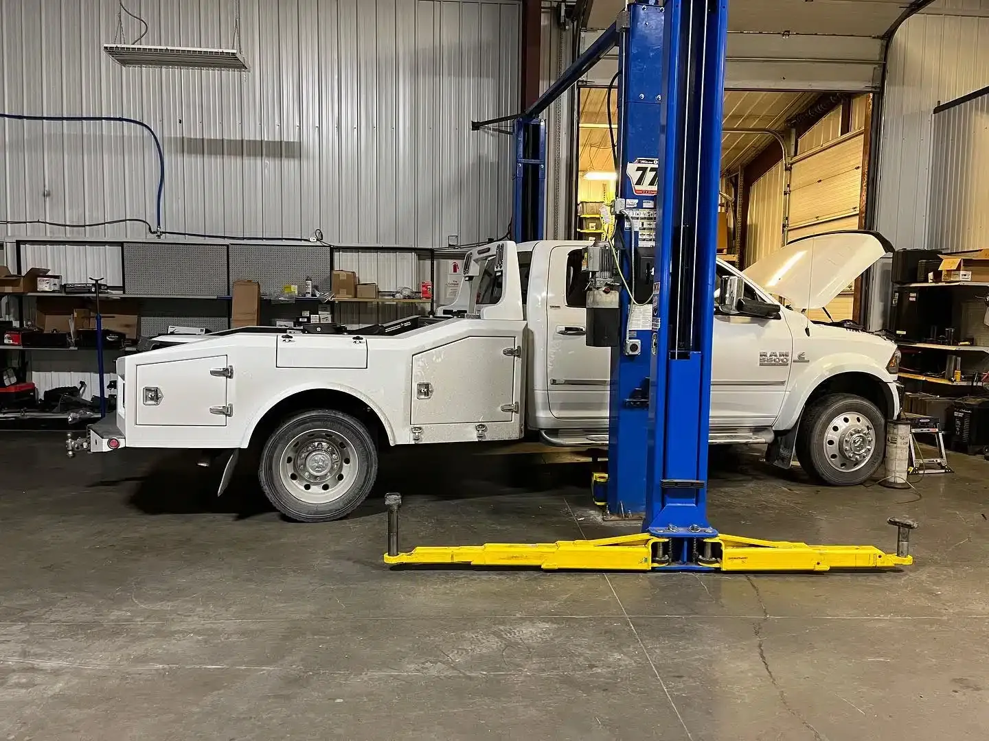 White Ram service truck raised on a lift in the 1023 Diesel & Fleet shop